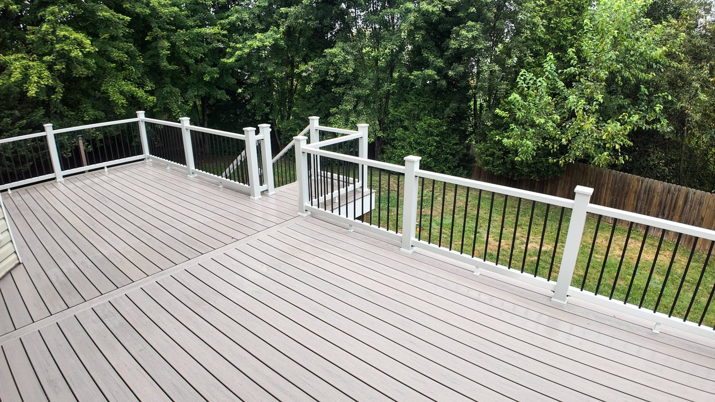 Custom composite deck with white railing built by Stoneridge in Virginia