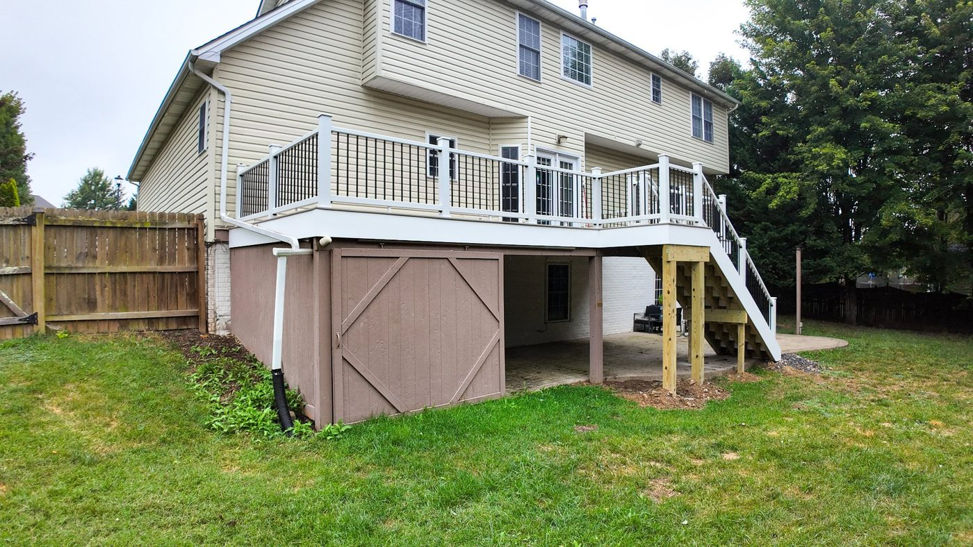 New deck stairs with white railing