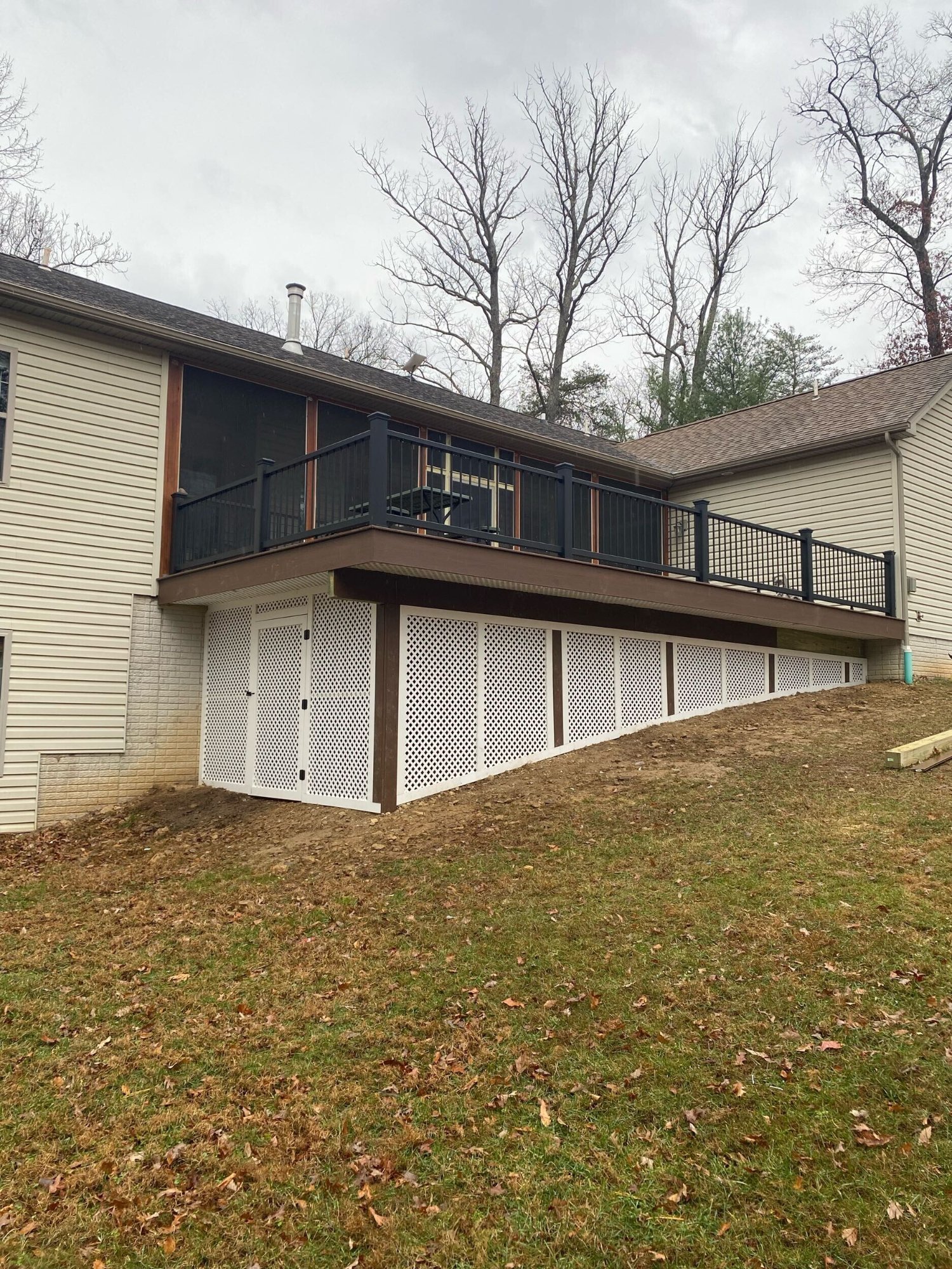 Covered deck with screen room and lattice skirting