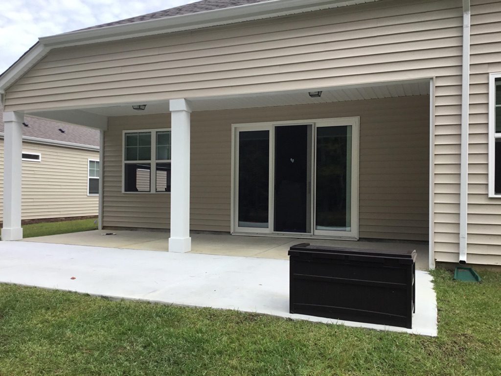 Open back patio before a Crystal View porch enclosure