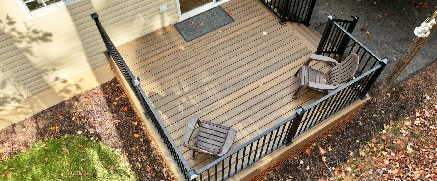 Custom deck builder Virginia — Stoneridge multilevel composite deck with stone patio and screened porch