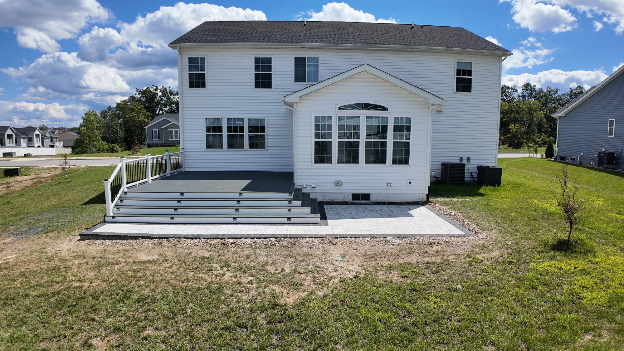 Composite deck with outdoor dining area and mountain view built by Stoneridge in Richmond Virginia