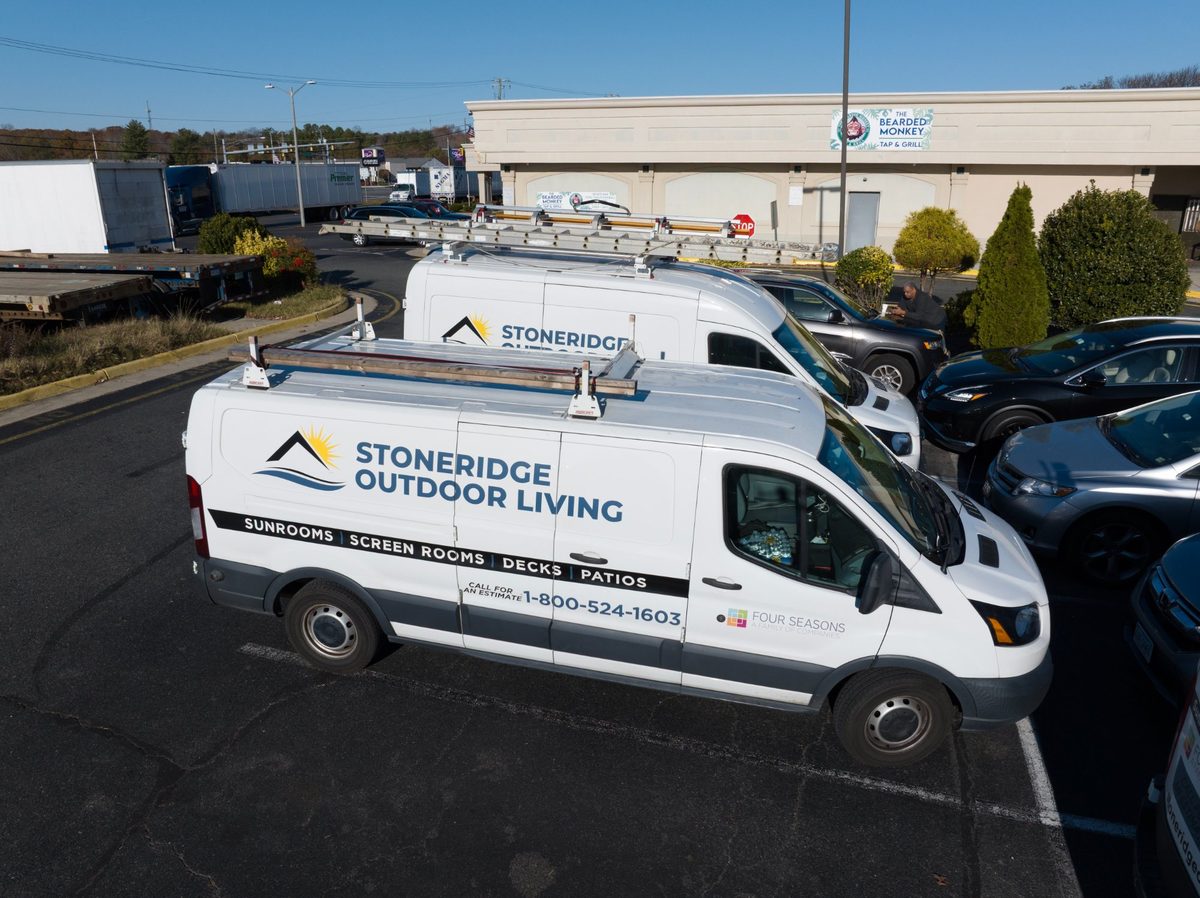 Aerial view of Stoneridge Decks branded work vans