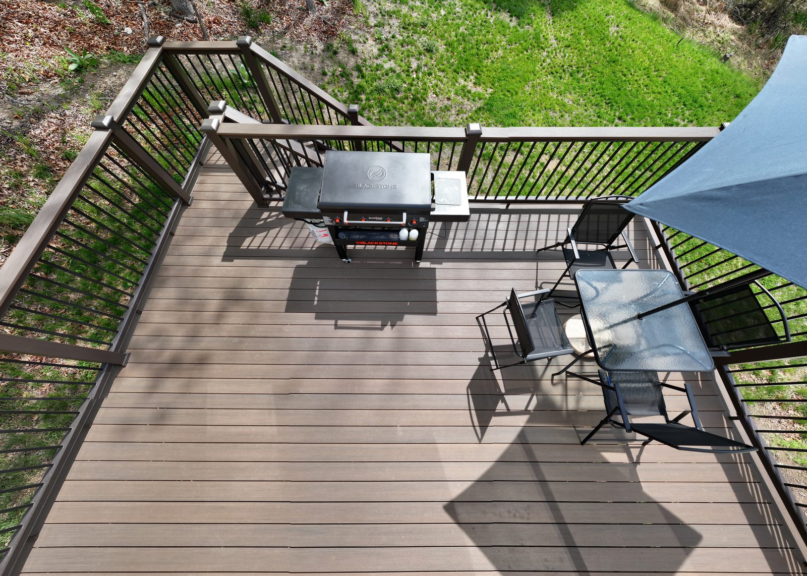 Bird eye view of composite deck with Blackstone grill and outdoor dining built by Stoneridge Decks for Vets