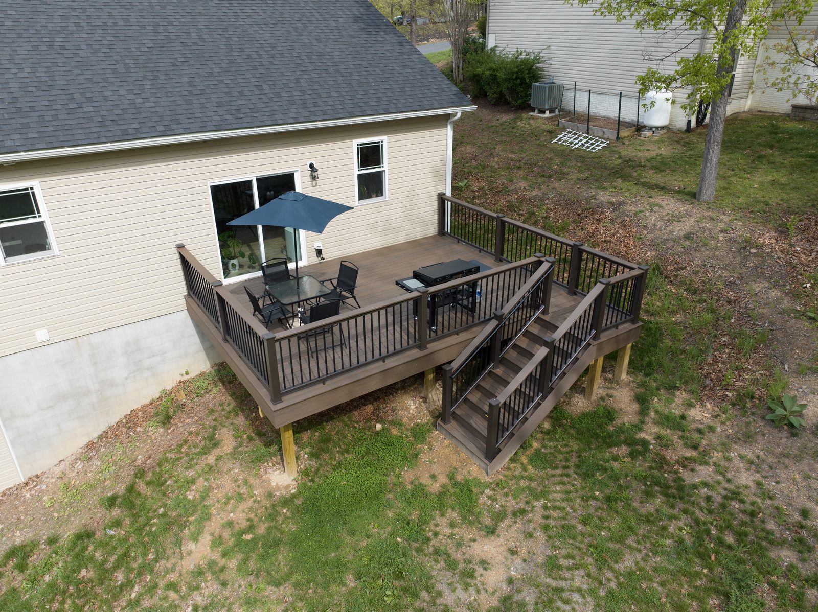 Aerial view of composite deck with dining area built by Stoneridge Decks for Vets program for the Bateman family in Frederick County VA