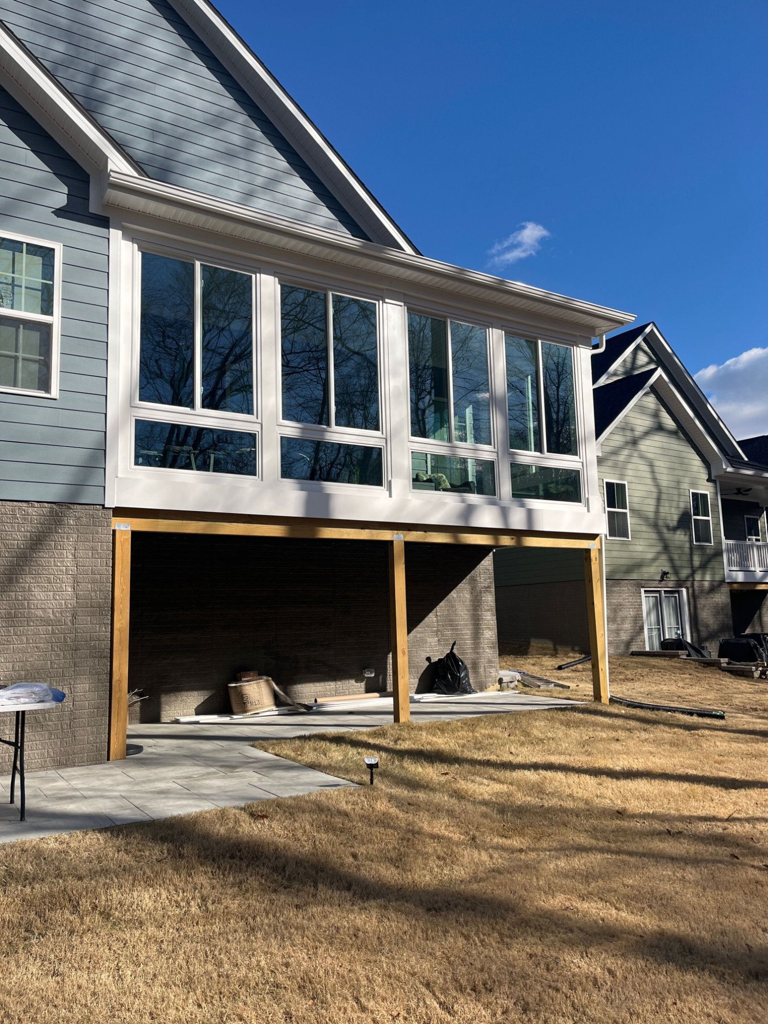 Elevated porch enclosure with posts built by Stoneridge Decks in Virginia