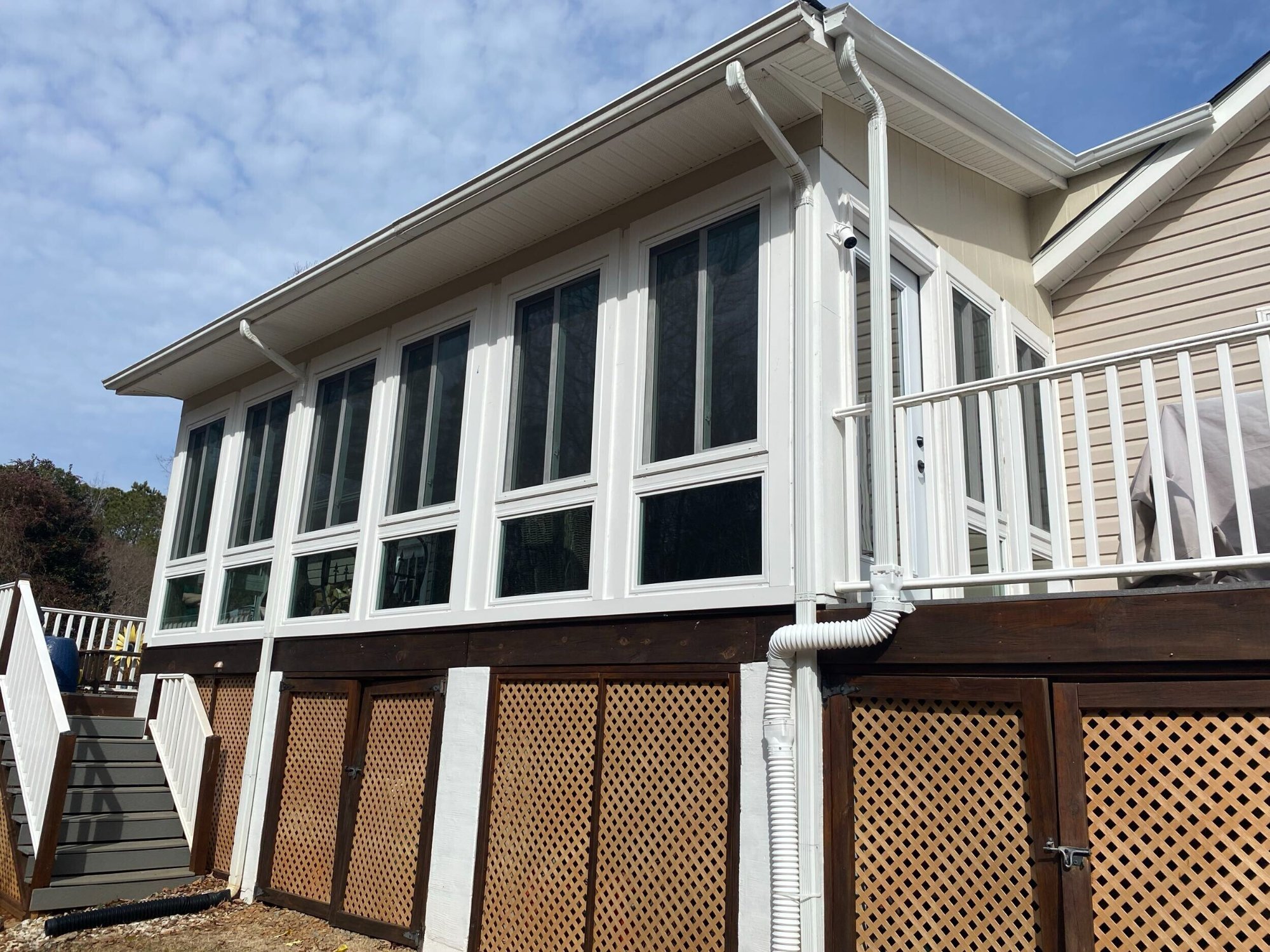Porch enclosure with lattice built by Stoneridge Decks in Virginia