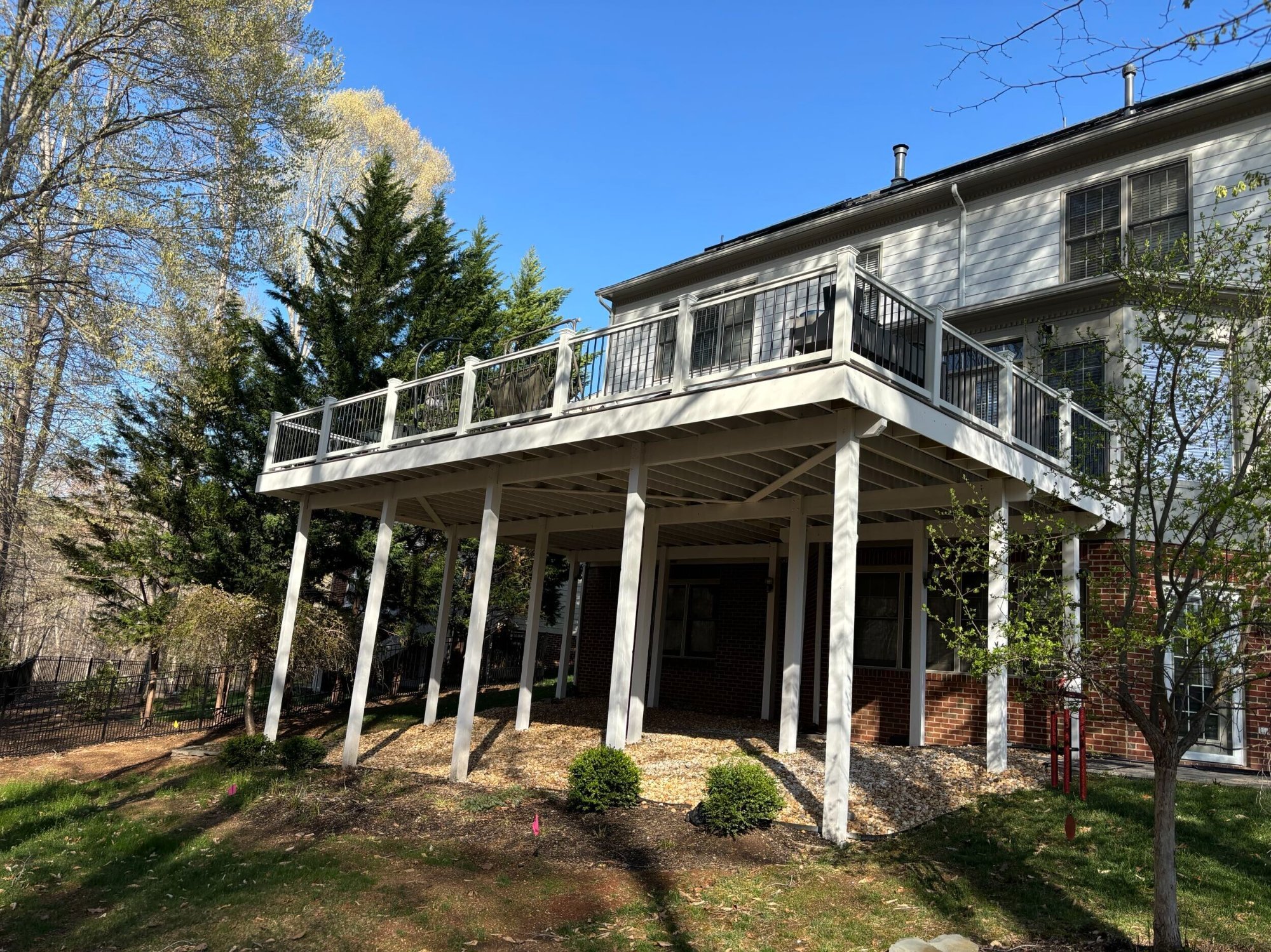 Large elevated deck white posts