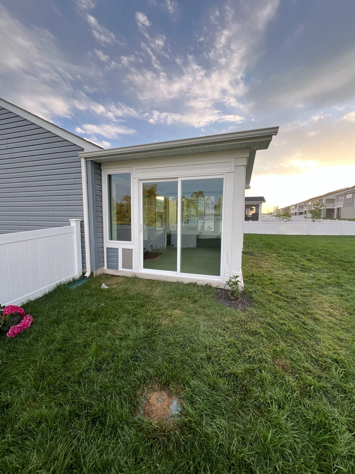 Porch enclosure ground level exterior built by Stoneridge Decks in Virginia