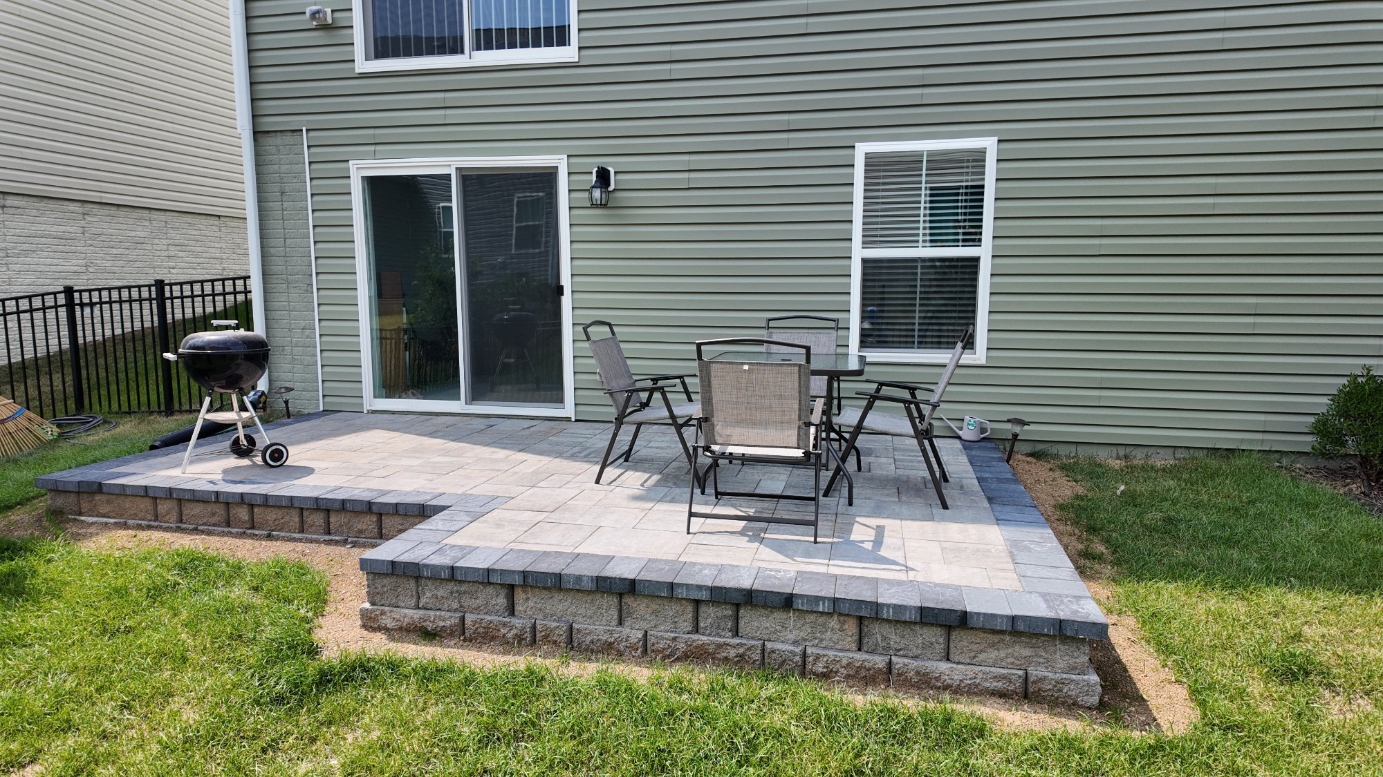Custom paver patio with dining and grill built by Stoneridge in Chesterfield VA