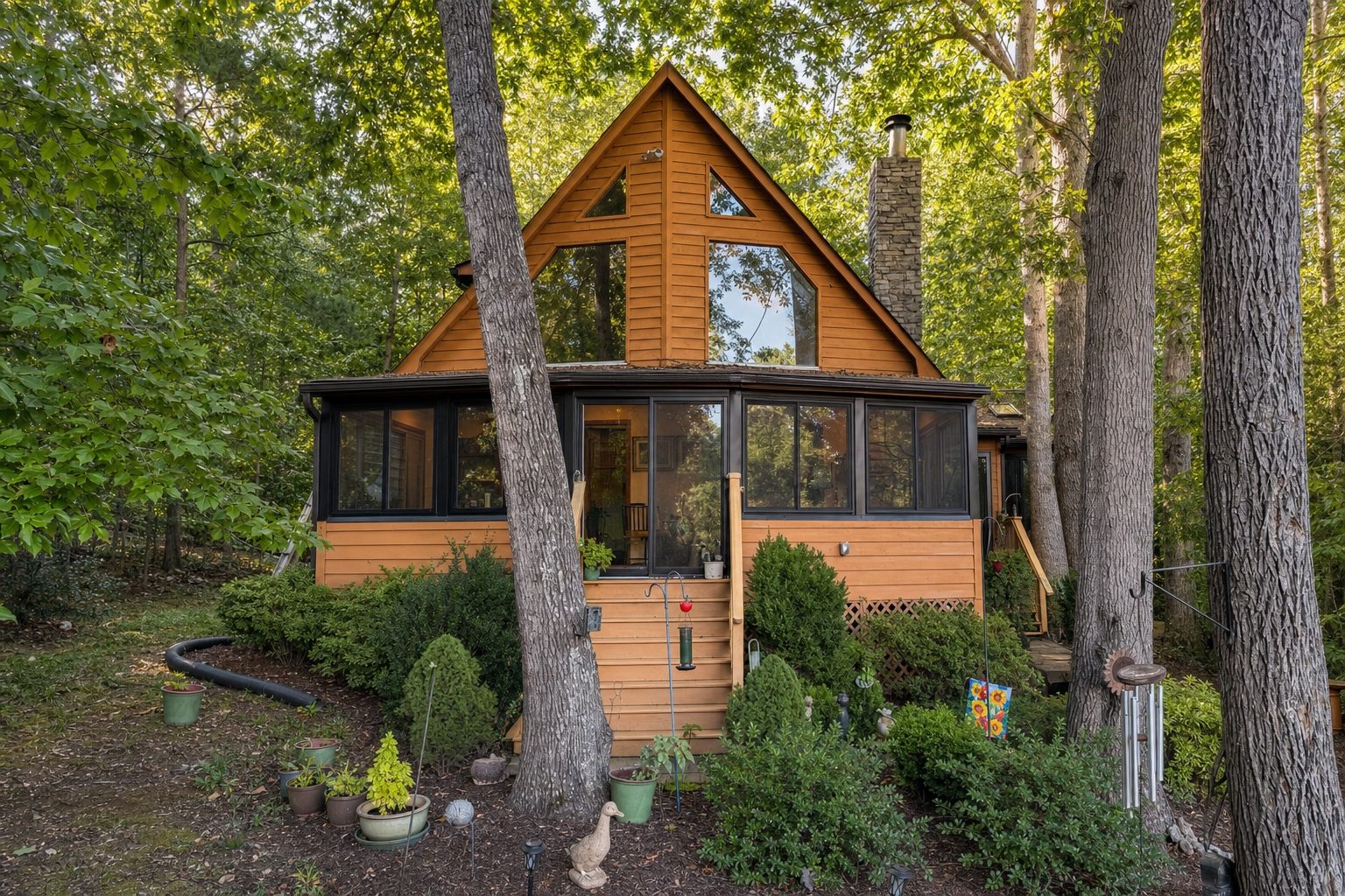 Sunroom on an A-frame home on a wooded lot built by Stoneridge Decks at Lake Anna, Virginia