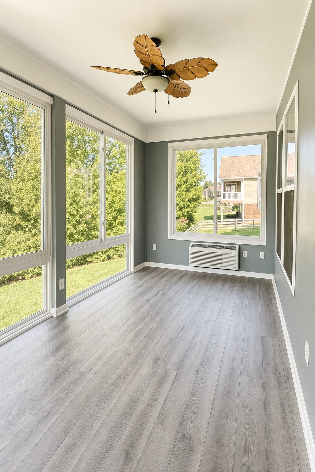 Bright sunroom interior with floor to ceiling windows built by Stoneridge Decks in Glen Allen, Virginia