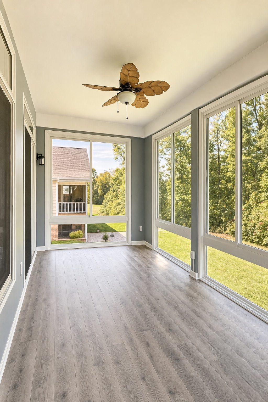 Sunroom interior with ceiling fan built by Stoneridge Decks in Glen Allen, Virginia