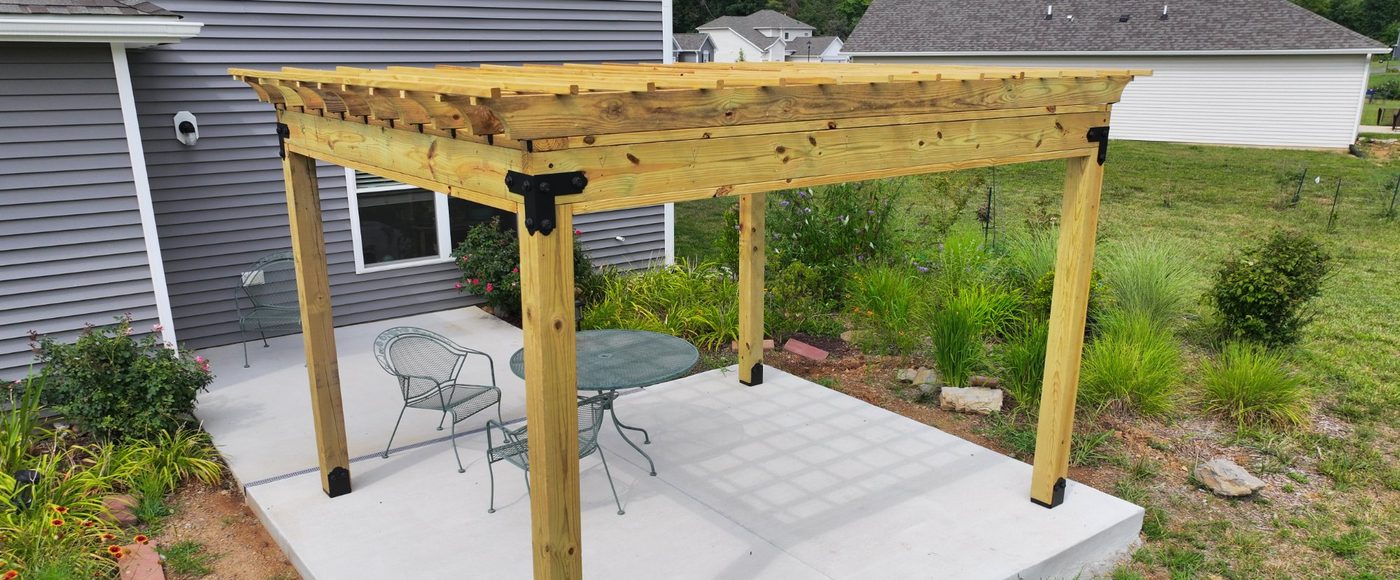 Wood pergola over concrete patio built by Stoneridge Decks in Virginia